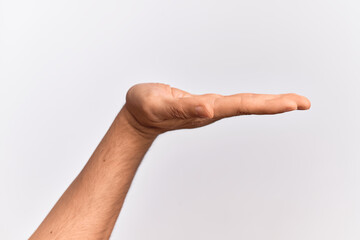 Hand of caucasian young man showing fingers over isolated white background with flat palm presenting product, offer and giving gesture, blank copy space