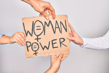 Hands of caucasian people asking for women rights holding banner with woman power message over isolated white background