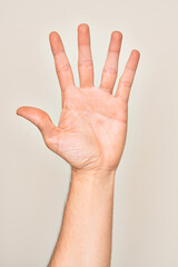 Hand of caucasian young man showing fingers over isolated white background counting number 5 showing five fingers
