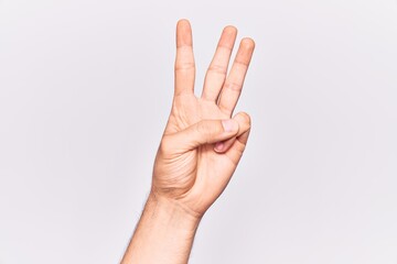 Close up of hand of young caucasian man over isolated background counting number 3 showing three fingers