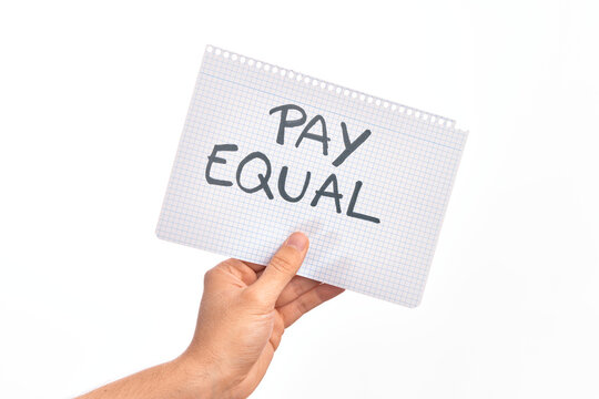 Cardboard banner protesting for equal payment for women and men over isolated white background