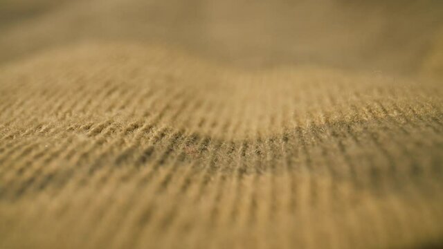 Close up, rack focus on camo pattern fabric