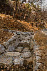 Drainage ditch constructed of large boulders