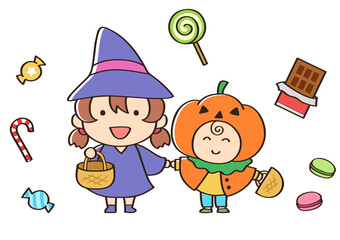 ハロウィンに魔女とかぼちゃの仮装をしてお祝いする子ども