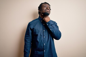 Young handsome african american man wearing casual shirt standing over white background Touching painful neck, sore throat for flu, clod and infection