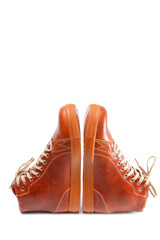 Motorcyclist Footwear Concepts. Pair of Motorcycling Tanned Leather Protective Sneakers Placed Over White Background.