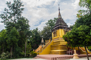 Fototapeta premium Beautiful golden Buddhist pagoda at Wat Phra That Doi Prabat (Wat Doi Phra Baht). Doi Phrabat Temple is the location of important historical sites and ancient religious in Chiang Rai, Thailand.