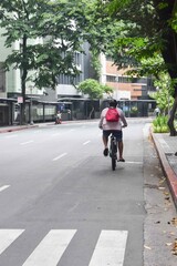 Lone Man Biking on an Empty Street during Covid-19 Pandemic