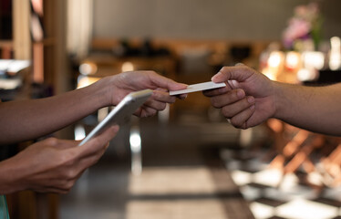 Girl holding credit card and texting