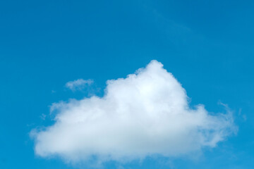 Beautiful natural sunny blue sky background with cotton candy white cumulus clouds & puffy fluffy...