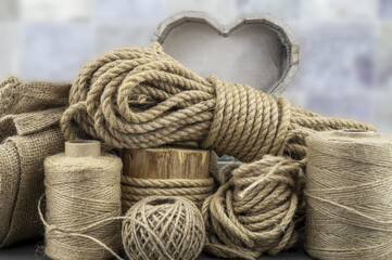 Assorted balls of jute twine with rope and slate