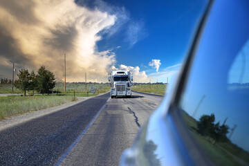 a truck chasing a car on highway in America