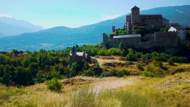 Pan right on medieval Valere Basilica castle in Swiss Alps