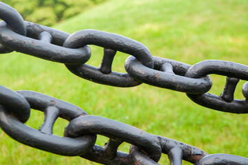 close up of black chains
