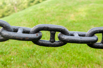 close up of black chains
