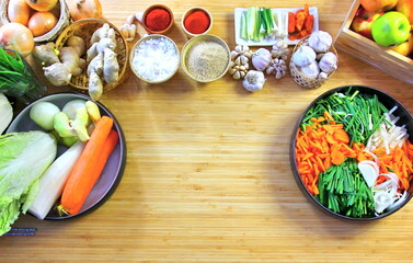 top view fresh vegetables in bowl  sugar salt chili  raw material for cooking kimchi Korea traditional foor preservation on wood table ,copy space