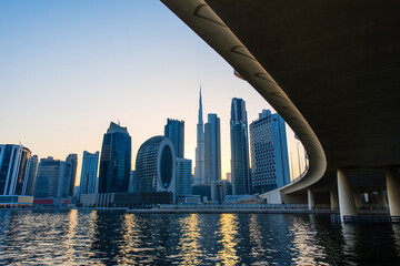 Fototapeta na wymiar Dubai downtown skyline at sunset. Futuristic city panoramic view. 