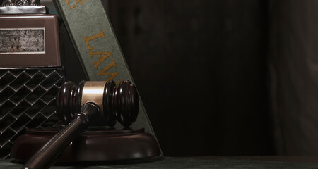 Judge’s gavel on black background, shoot in low light. Law concept.