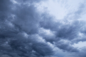 Beautiful sunny blue sky background with cotton candy white cumulus clouds & natural puffy fluffy cloudscape in tropical summer or spring sunlight & sun rays on bright daylight horizon at sunshine day