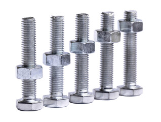 A row of metallic silver hexagon head bolts with screwed nuts closeup isolated on a white...
