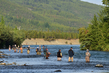Anglers fish for sockeye salmon (Oncorhynchus nerka) at the confluence of Alaskaâ€™s Kenai and...