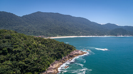 Aerial view to wonderful Green Coast shoreline and mountains covered with Atlantic Forest, Picinguaba, Brazil
