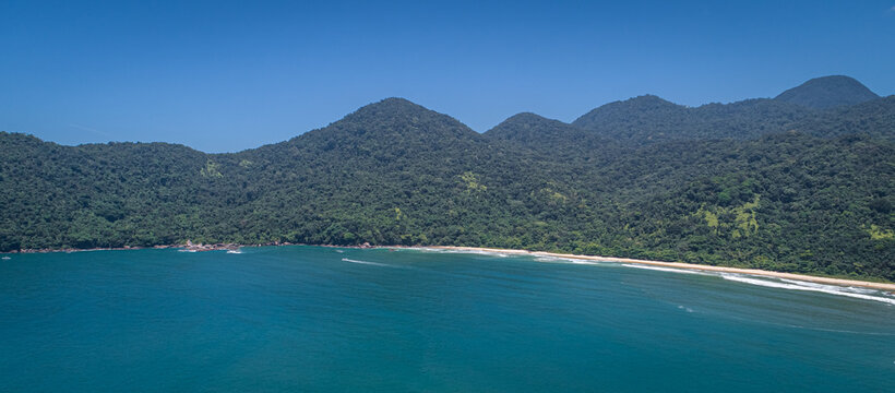 Panoramic aerial view to wonderful Green Coast shoreline and mountains covered with Atlantic Forest, Picinguaba, Brazil
