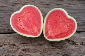 The heart shape of fruit water melon on wood background