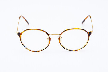 Fashion sunglasses golden and black frames on white background.