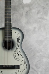 Vintage ladies antique guitar on a concrete base