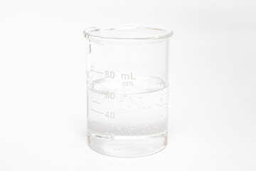 experiment liquid in beaker with scale on white background