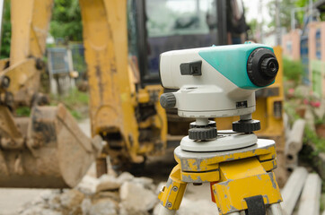 Blue and white surveyor telescope on tripod