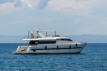 Fototapeta na wymiar Huge luxury motor yacht cruising in a calm ocean