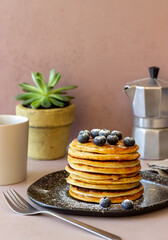 Pancakes with blueberries and honey. Breakfast. Vegetarian food. Recipe.