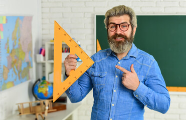 geometric shapes. physics research. math teacher at blackboard. education. exact sciences. happy...