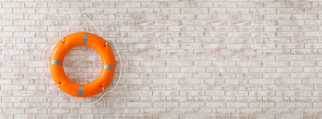 Lifebuoy ring on brick wall with space for text