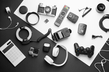 Different modern devices on black and white background