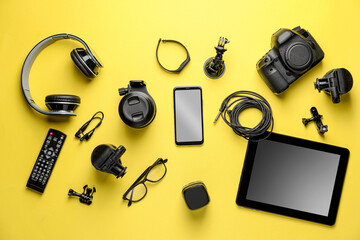 Fototapeta na wymiar Different modern devices on color background