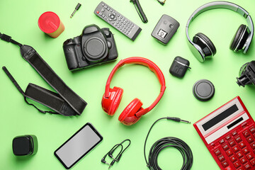 Different modern devices on color background