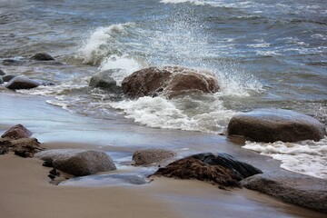 Waves crashing the rocks on the beach
