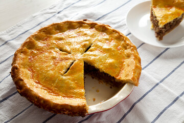 Tasty Homemade Canadian Tourtiere Meat Pie, side view.