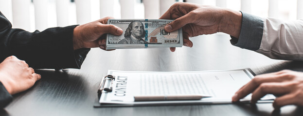 Black suit female staff gives bribes to male employees