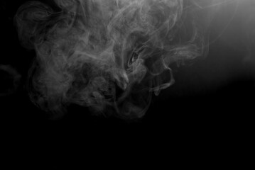 White smoke on a black background. The texture of scattered smoke. Blank for design. Layout for collages.