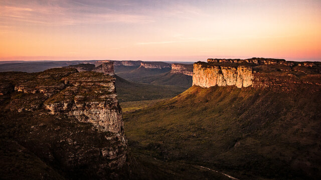 Morro do Pai Inacio, Landscape of a mountain range with colorful sky above, Sunset colors and pristine nature with the view of valley and mountains,