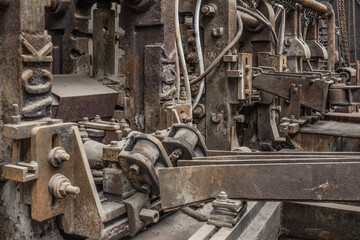 Old rusty steel rolling machinery.