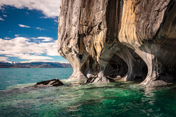 Marble Caves in Chile. Caves on a lake with deep blue water and beautiful background landscape.