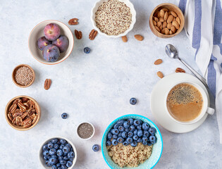 Ingredients for a healthy breakfast, quinoa with blueberry, fig, honey and nuts. Concept vegan and healthy eating. Top view
