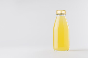 Yellow pineapple juice in glass bottle with gold cap mock up on white background with copy space, template for packaging, advertising, design product, branding.