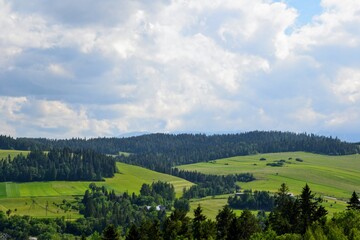 Fototapeta premium Mountain landscape with hills and trees. Podhale, Poland