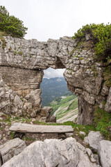 View of the mountains from rock window at the Loser peak in Austrian Alps. Dead Mountains (Totes Gebirge)